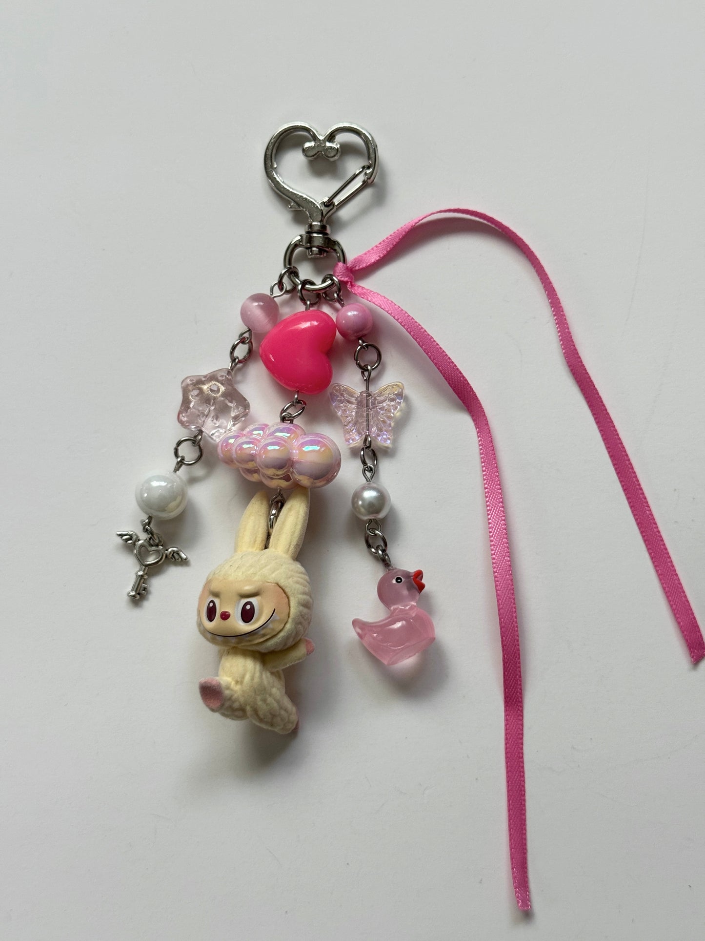cream yoga labubu keychain