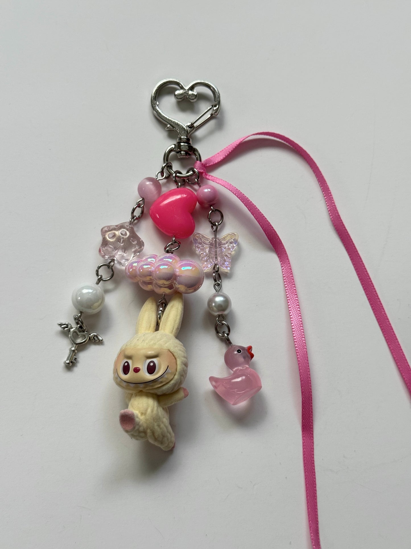 cream yoga labubu keychain