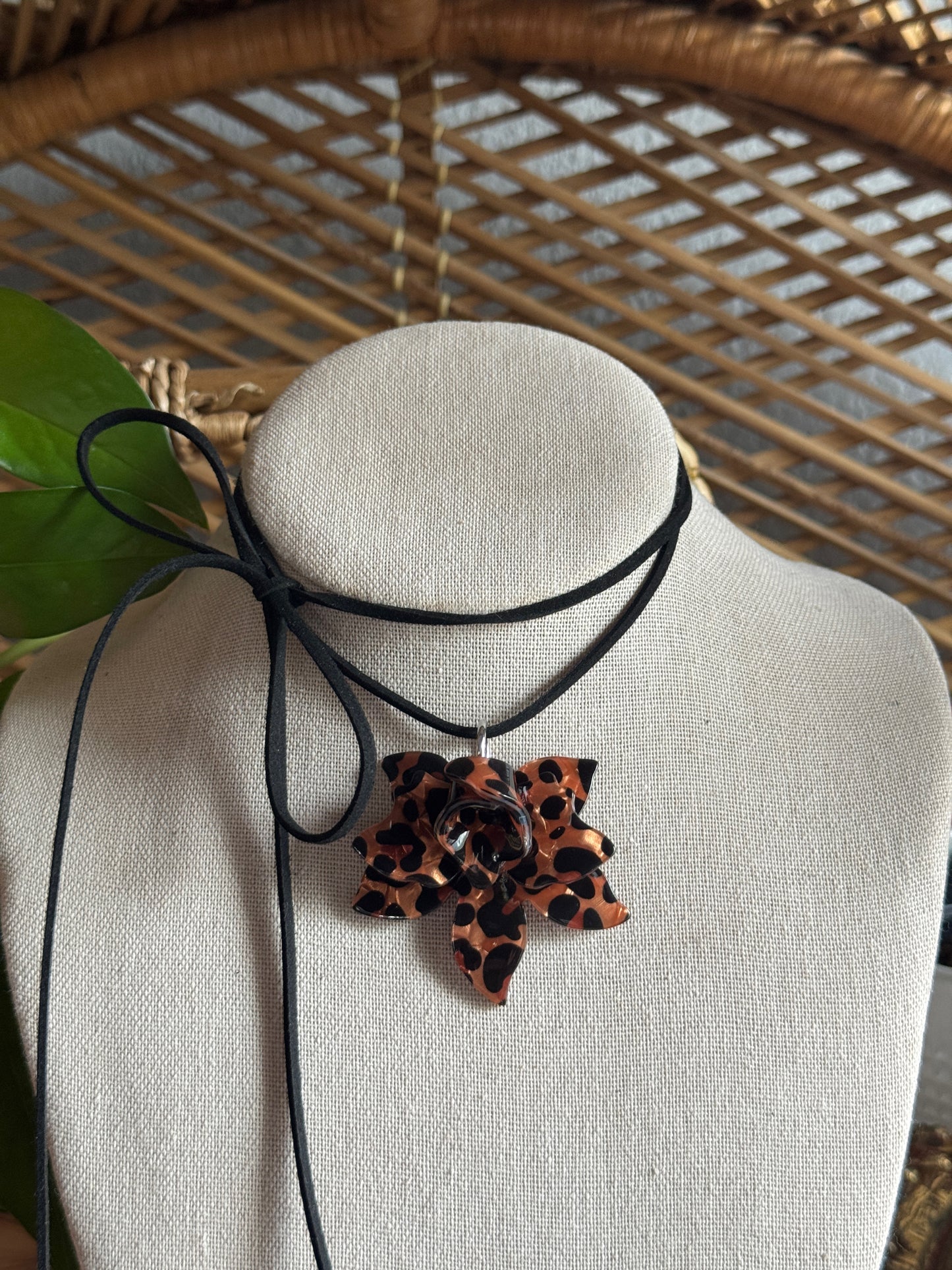 tortoise flower black suede cord necklace