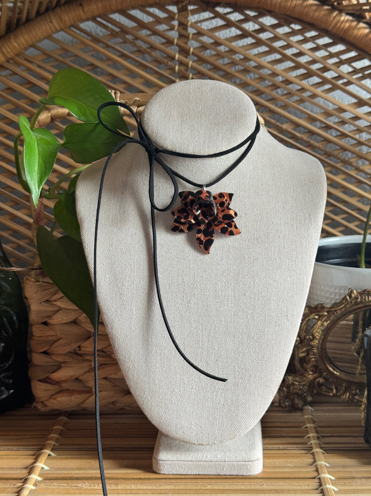 tortoise flower black suede cord necklace