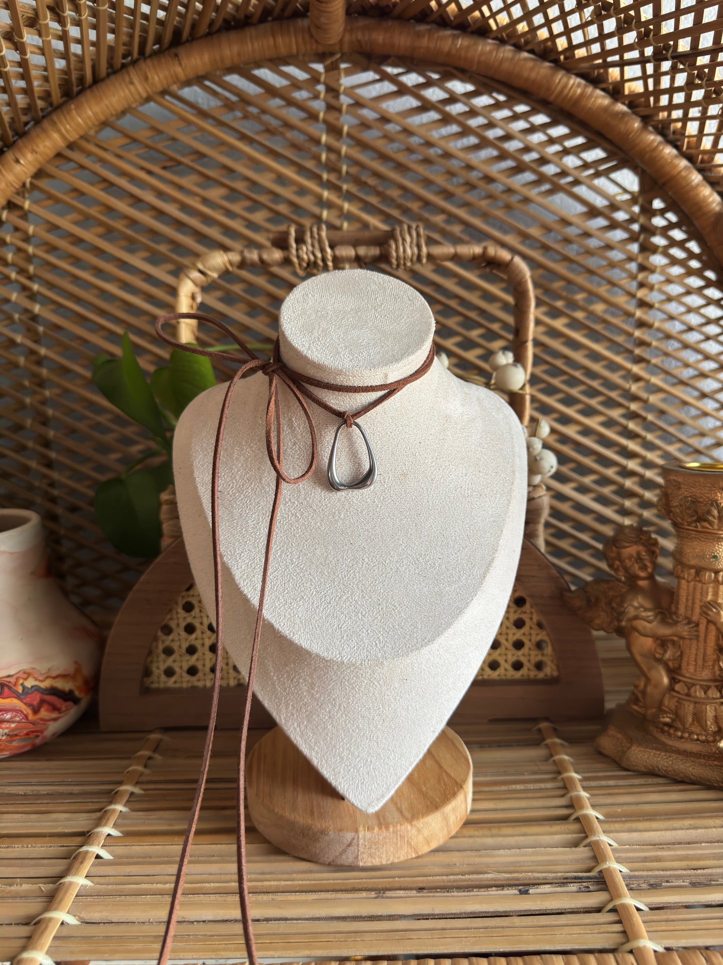 stainless steel pendant knot brown suede necklace