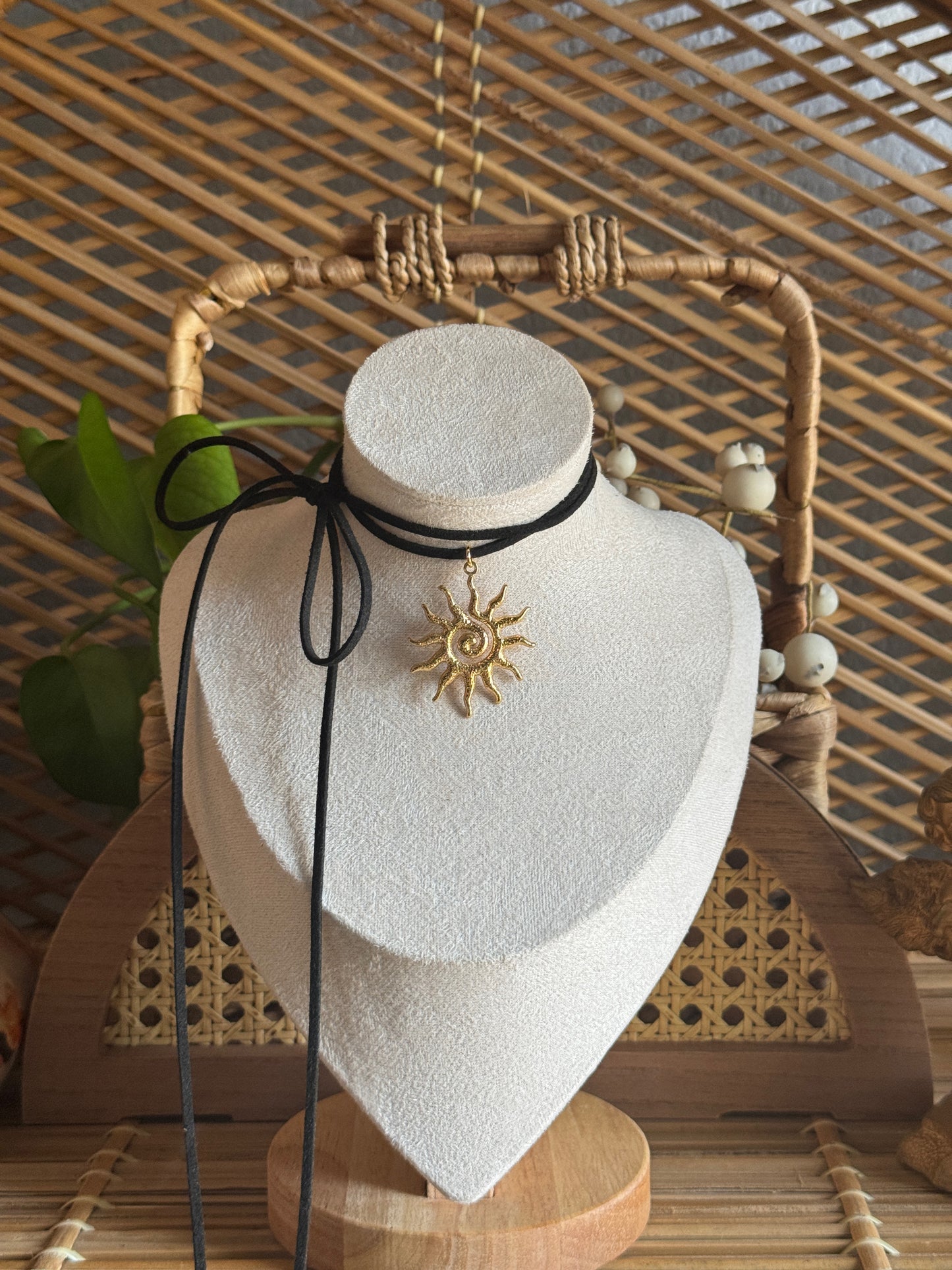 gold swirl sundial black suede necklace