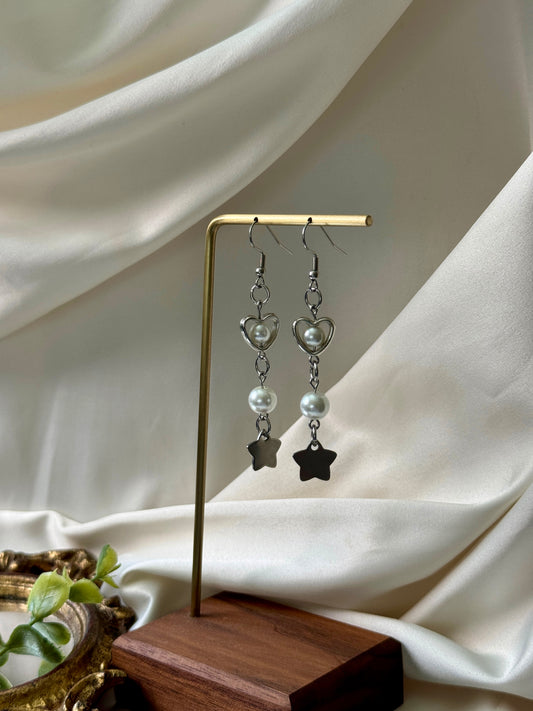 vela earrings