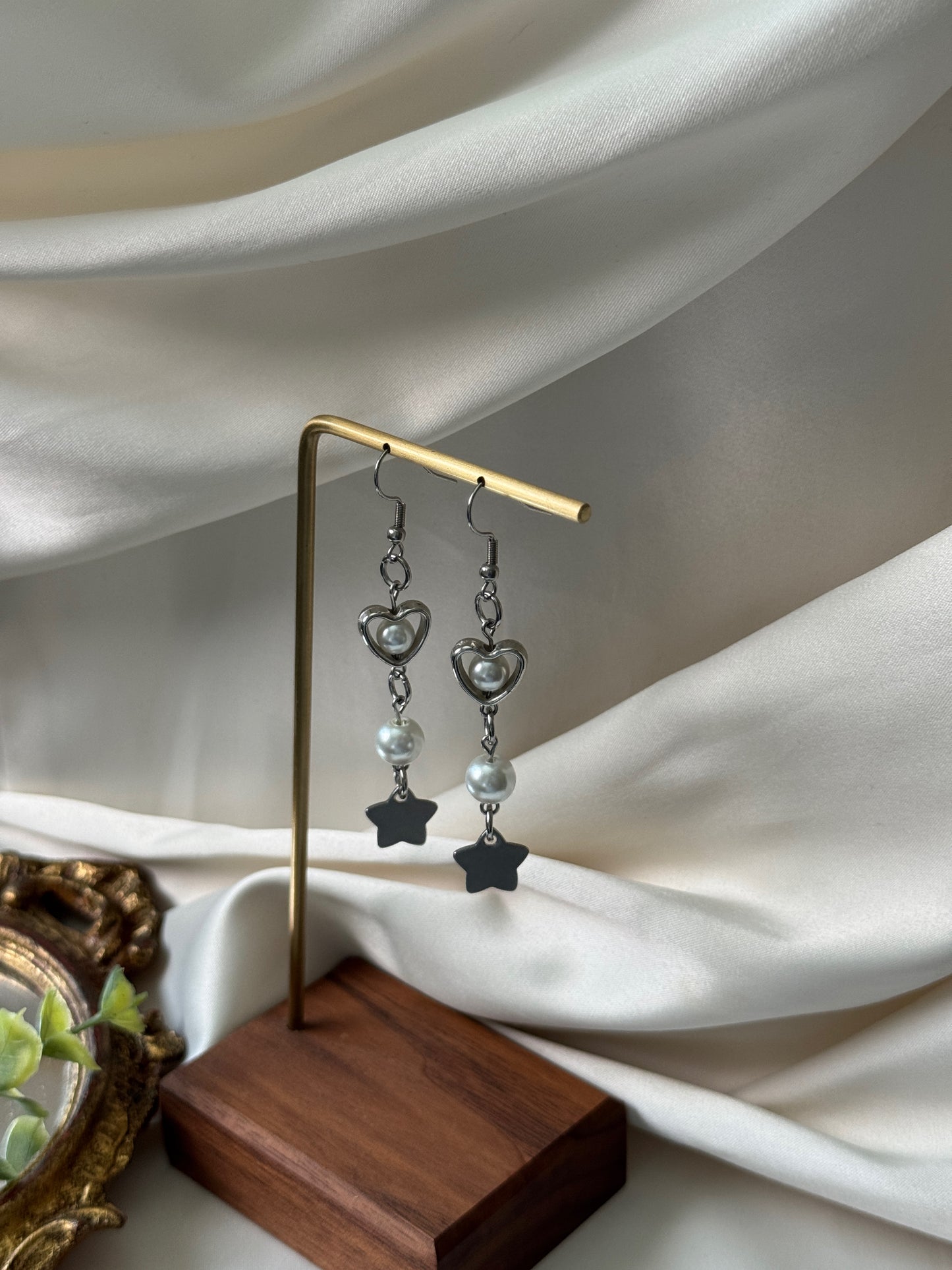 vela earrings