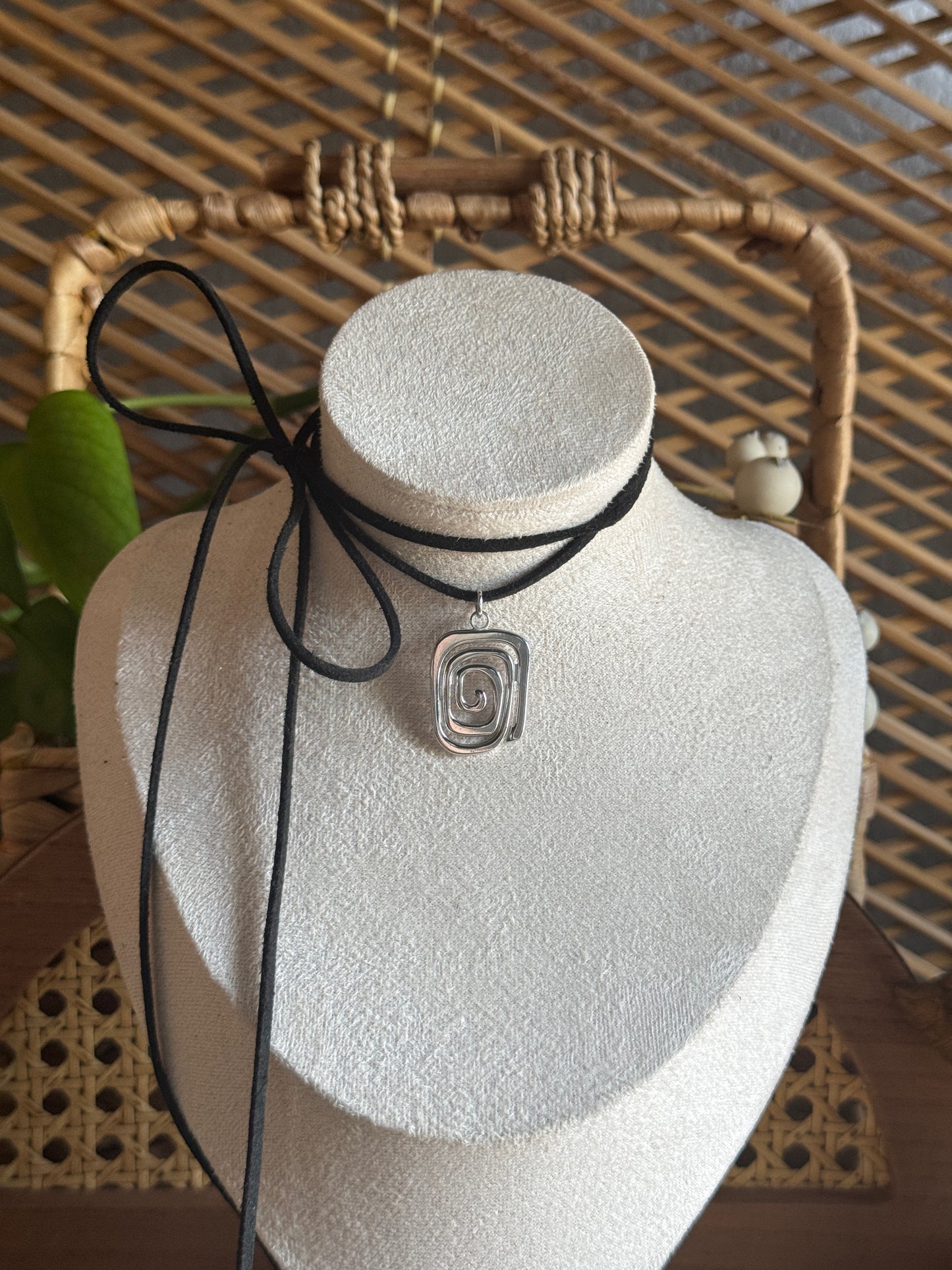 irregular stainless steel swirl black suede necklace